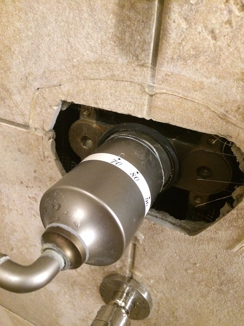 How to adjust bath mixer temperature